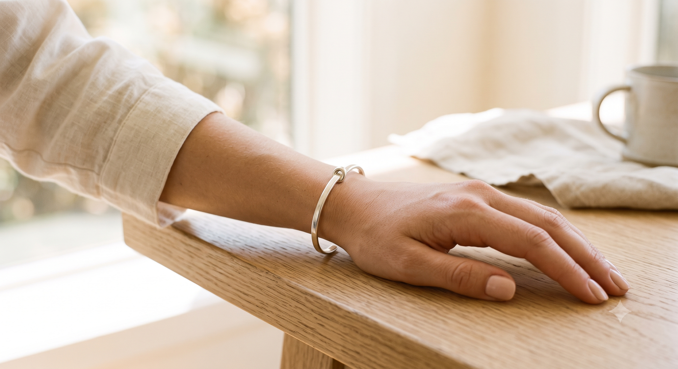 Anchor — silver knot bracelet on wrist
